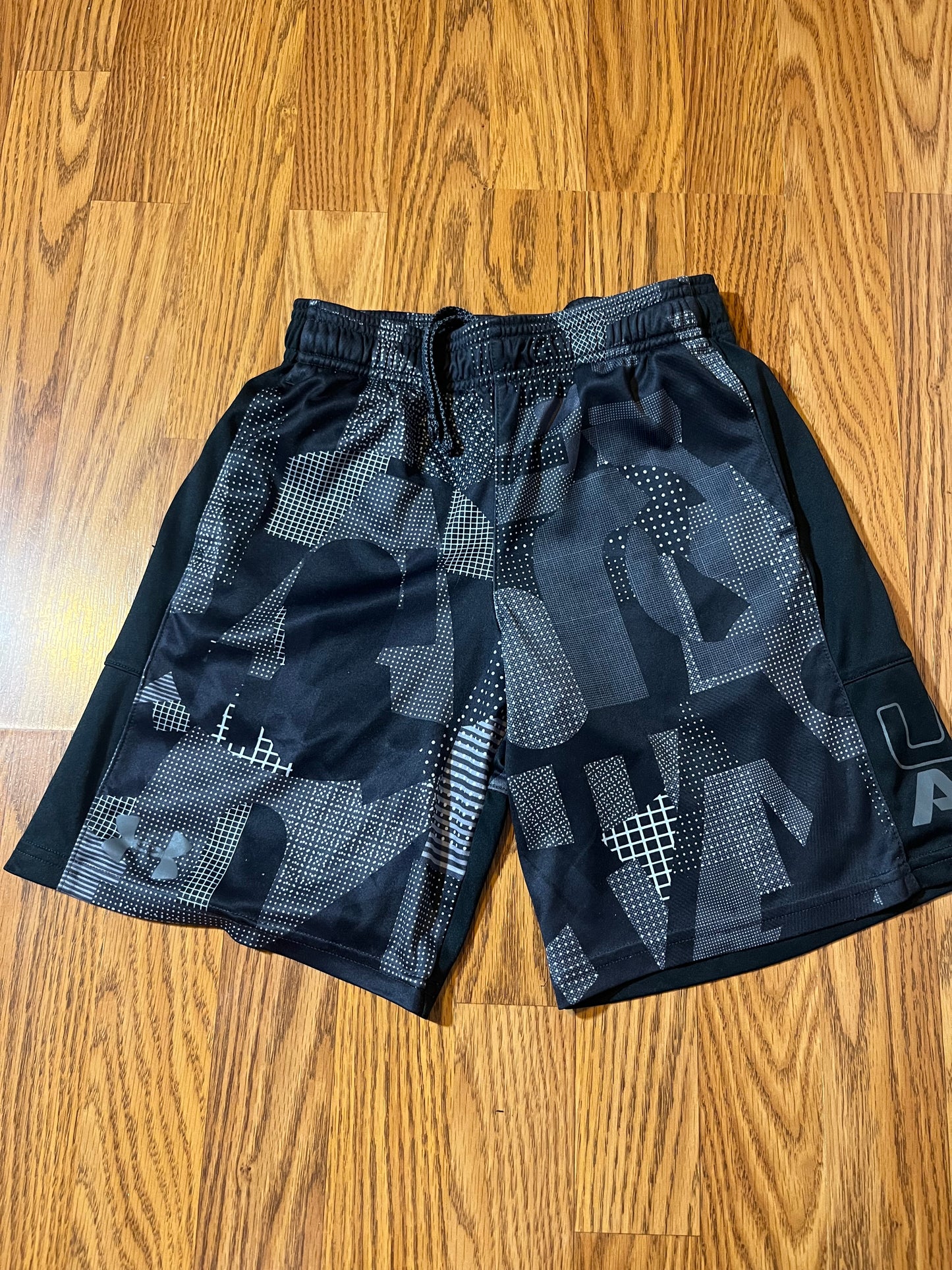 Under Armour shorts size YSM (online chart says 7/8)