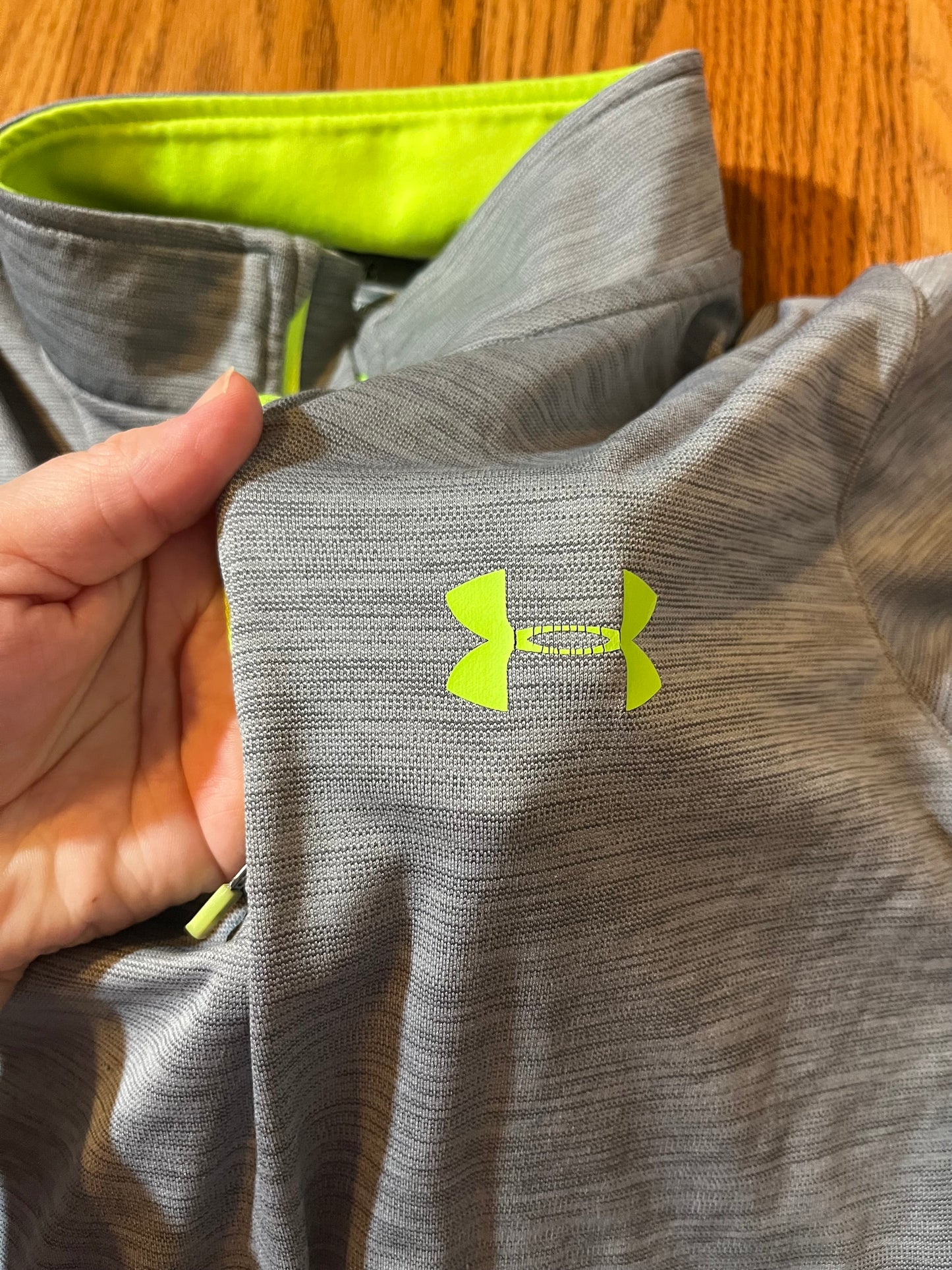 Under Armour YLG (online chart says size 14) a little bit aware on the emblem, but not bad extra photo to show